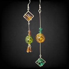 Epic Blown Bubble Glass Irregular Dangle Earrings Women Fashion Goldtone Earth Tones These Superb Earrings Feature Blown Bubble Glass In Earth Tones, Creating A Unique And Irregular Dangle That Adds A Stylish And Artistic Flair To Any Outfit. The Goldtone Finish Provides A Gorgeous Contrast To The Organic Glass Shapes, Making These Earrings A Cool And Chic Accessory. Perfect For Women Who Love Fashion-Forward And One-Of-A-Kind Jewelry, These Earrings Are Both Elegant And Playful. Keywords: Blown Earrings Boho Chic, Earth Tone Color, Organic Glass, Artisan Earrings, Bubble Glass, Earrings Women, Chic Accessories, Glass Earrings, Earth Tones