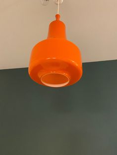 an orange light hanging from the ceiling