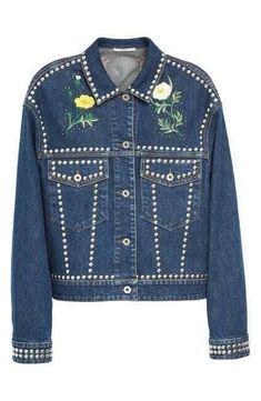 Stella McCartney Dark Blue Embellished and Embroidered Denim Jacket MSRP $1925.00 About This Item Stella McCartney's luxurious take on the denim jacket reflects her passion for clothes that are beautiful and special but also so wearable. Framed by polished silver tone studs, this dark-blue piece is intricately embroidered with pretty birds and flowers which are adorned with rhinestones, bringing artisanal charm to the iconic denim jacket. Complement the oversized jacket with a relaxed skirt or w Cute Jean Jackets, Embellished Denim Jacket, Embroidered Denim Jacket, Birds And Flowers, Embellished Denim, Blue Jean Jacket, Pretty Birds, Oversized Jacket, Embroidered Denim