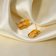 Introducing the Lea Earrings, the perfect accessory for those who prefer a minimalist look with a touch of shine. These high polish earrings are sure to elevate any outfit with their sleek and simple design. A must-have for any jewelry collection! They are made to last , hypoallergenic and waterproof 18K PVD Gold Plated 316L Stainless Steel .70 inches high x .47 inches wide Minimalist Metal Clip-on Earrings For Gift, Minimalist Gold-plated Drop Cartilage Earrings, Minimalist Gold Plated Drop Cartilage Earrings, Minimalist Gold Plated Single Earring, Modern Gold Plated Plug Earrings As Gift, Modern Gold Plated Plug Earrings For Gift, Modern Gold-plated Plug Earrings As Gift, Formal Minimalist Gold Plated Clip-on Earrings, Minimalist Metal Clip-on Earrings As Gift