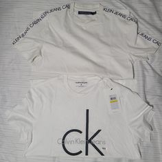 2 Shirts One Used But In Great Condition The One With The Words On The Side The Other Brand New. Calvin Klein Crew Neck Top With Logo Print, Calvin Klein Crew Neck T-shirt With Logo, Calvin Klein Logo Print Crew Neck T-shirt, Calvin Klein Logo Print Crew Neck Top, Calvin Klein Graphic T-shirt For Streetwear, Calvin Klein Logo Print T-shirt For Streetwear, Calvin Klein Graphic Tee For Streetwear, Calvin Klein Short Sleeve Streetwear Top, Calvin Klein Cotton T-shirt With Letter Print