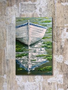 a painting of a boat in the water on a stone wall with green algae growing around it