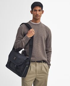 Field Waxed Satchel Whether you're looking for a reliable bag to accompany you on your commutes or a crossbody staple for hands-free wear, the Barbour Field Waxed Messenger Bag makes the perfect choice. This waxed style features an adjustable webbed shoulder strap for comfortable wear, a grab handle and inner laptop compartment to keep your essentials safe on-the-go. Classic Waxed Finish Shoulder Backpack, Classic Shoulder Bag With Waxed Finish, Classic Shoulder Bag For Everyday Use, Classic Waxed Satchel Backpack, Casual Satchel Camera Bag With Removable Pouch, Functional Shoulder Bag With Top Carry Handle For Work, Workwear Flap Shoulder Bag With Top Carry Handle, Functional Workwear Satchel With Top Carry Handle, Functional Satchel For Workwear With Top Carry Handle