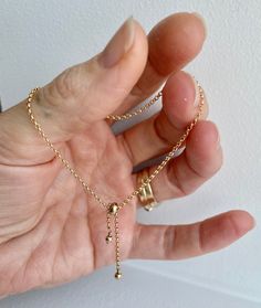 A dainty gold filled every day bracelet! It slips on so easily and adjusts with a 14k gold filled 4mm slider bead to your desired fit! So delicate and dainty on its own or excellent little addition to stacking a few pretties on your wrist! The chain is 14k gold filled rolo style 8.5 inches long **PLEASE** if you require a different length measure your hand (in the photos there is an illustration to show you how to measure properly) and tell me your size in a message so I can be sure it fits you Simple Adjustable Gold Bracelet For Everyday, Adjustable Delicate Gold Bracelet For Everyday, Minimalist Hypoallergenic Adjustable Gold Bracelet, Everyday Resizable 14k Gold Filled Jewelry, Adjustable Hypoallergenic Gold Bracelet For Everyday, Adjustable Hypoallergenic Gold Bracelet, Hypoallergenic Adjustable Gold Bracelet For Everyday, Everyday Adjustable Hypoallergenic Gold Bracelet, Gold Lariat Bracelet For Gift