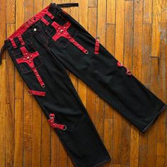 Vintage Y2k Tripp Nyc Wide Leg Pants Women Black Red Silver Metal Stud Goth Rave Streetwear Goth Punk Tripp Nyc Pants Perfect For Going Out Party Festival Rave Concert School College Halloween Costume Cosplay. Fitted Belt Looped Waistline With Zipper Fly And Metal Skull Button Close Front. Two Front Side Pockets With Two Zipper Back Butt Pockets. Zipper Adjustable Back Wide Legs. Multiple Accent Metal Clasps. In Excellent Condition. Size - Women - 11 #Vintagetrippnyc #Trippnycpants #Y2ktrippnyc Rave Streetwear, College Halloween Costume, Tripp Nyc Pants, Rave Concert, Streetwear Goth, Goth Rave, Wide Leg Pants Women, Metal Skull, College Halloween