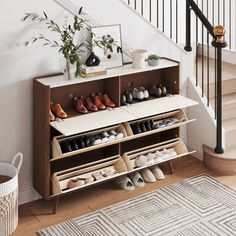 a shoe rack with shoes on it next to a stair case