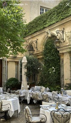 an outdoor dining area with tables and chairs