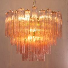 a chandelier hanging from the ceiling in a room