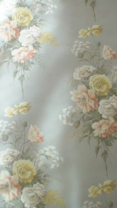 the wall paper has flowers on it