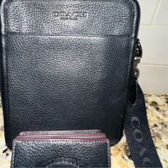 Black Leather Coach Crossbody Purse With Coach Lettered Strap And A Coach Leather Wallet. Purse And Wallet Come As A Set For $250. Virtually Brand New. I Bought In Vegas In March As I Needed Something To Be On My Body To Protect Money. Once I Got Home I No Longer Used It. I Am Used To Big Bags. I Will Ship The Same Day Purchased. Designer Wallet With Removable Pouch For Travel, Designer Travel Wallets In Pouch Shape, Designer Travel Wallet Pouch, Designer Travel Pouch Wallets, Black Everyday Bifold Bag, Black Leather Bag With Coin Pocket, Black Shoulder Bag With Coin Pocket For Daily Use, Travel Wallets In Black Textured Leather, Black Leather Shoulder Bag With Coin Pocket