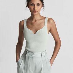 Nwt. Reiss Daisy In Mint Green. The Sweetheart Neckline Of The Daisy Top Lends A Note Of Classic Femininity To A Staple Style. It's Crafted In A Ribbed Knit To A Sleeveless Profile That Hugs The Frame. Team With Flared Trousers And Heels For An Elegant Edit. Sweetheart Neckline. Ribbed Knit. Sleeveless Sleeveless Ribbed Size Xl Armpit To Armpit 18” Waist 16” Length 23” 56% Viscose, 43% Nylon, 1% Elastane. Hand Wash Only Reiss Women, Daisy Top, Tie Front Cardigan, Flared Trousers, Silk Tank Top, Gray Silk, Silk Tank, Sweetheart Neck, Sleeveless Tank Top