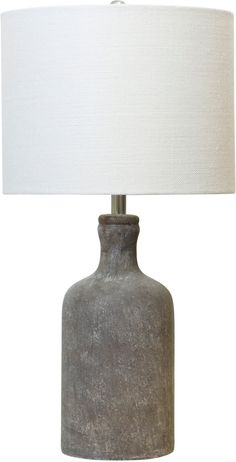 a gray ceramic lamp with a white shade