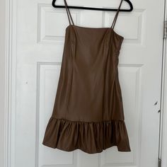 Nwt Zara Faux Leather Baby Doll/Swing Dress With Spaghetti Straps Spring Mini Dress With Ruffle Hem In Brown, Spring Brown Mini Dress With Ruffle Hem, Chic Brown Mini Dress With Ruffle Hem, Brown Mini Dress With Ruffle Hem For Fall, Brown A-line Lined Dress, Brown Ruffle Hem Dress For Day Out, Brown Ruffle Hem Dress, Chic Brown A-line Mini Dress, Brown Lined Mini Dress For Day Out