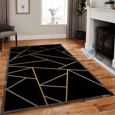 a black rug with gold lines on it in front of a fire place and fireplace