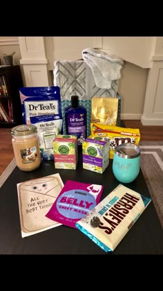 the contents of a diaper sitting on top of a table next to a jar