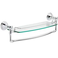 a glass shelf with two towel bars on it