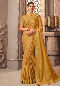 Organza Saree with blouse in Golden colour 1209A Desc: Color : Golden Fabric : Organza Work : Embroidery Wash Care : Dry clean Sleeve Style : Half Sleeve Long Sleeves : Done only in Custom Stitch Sleeves Lining : Done only in Custom Stitch Bust Size : 32 to 42 Inches Occasion : Temple Wear Social Gathering Pongal Gudi Padwa Onam Ugadi. With Express Free Shipping Buy Indian Party wedding wear Bridal Sarees Organza Saree with blouse in Golden colour 1209A online in USA, UK and Canada from KollyBol Gold Embroidered Blouse For Eid, Yellow Blouse With Zari Work For Eid, Gold Blouse With Zari Weaving For Navratri, Yellow Long Sleeve Blouse Piece With Zari Work, Yellow Blouse With Zari Weaving For Navratri, Gold Embroidered Saree Fabric, Semi-stitched Yellow Blouse For Eid, Yellow Semi-stitched Self Design Blouse, Festive Yellow Blouse With Zari Weaving