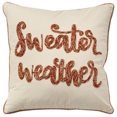 a pillow with the words sweater weather on it