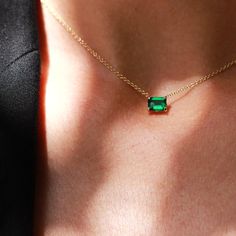 The delicate Eloise necklace radiates elegance and luxury. It features a mesmerizing Chatham Emerald gem that shines in a deep majestic green, Its elongated cut adorned your neck with a lush gleam. All features can be customized! Please contact us if you wish to make changes; we love making custom designs. All of our jewelry is carefully handmade in our atelier. *HC diamond are all conflict-free diamonds To order by phone 972-72-2991000 Luxury Green Emerald Necklaces, Elegant Green Solitaire Necklace For May Birthstone, Elegant Green Baguette Cut Necklace, Elegant Green Solitaire Necklace, Timeless Green Emerald Necklace As A Gift, Timeless Green Emerald Necklace As Gift, Timeless Green Emerald Necklace For Gift, Timeless Green Emerald Necklace Gift, Timeless Green Baguette Cut Jewelry