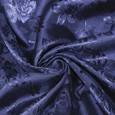 an image of a blue fabric with flowers on it