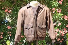 "Check out this vintage brown leather bomber jacket from the 70s. It has two pockets, two handwarmer pockets and an inside pocket. This is a very vintage piece with an incredible lining. Grab this today! Large Made in Korea Dimensions Pit to pit:23\"(58cm) Back:25\"(64cm) Shoulder:21\"(53cm) Sleeve:24\"(61cm) shell leather lining 100 acetate filler 100 polyester Condition: Excellent, Used - This item appears to have had very little wear. No noticeable flaws or defects. If you have any questions about this item, please do not hesitate to ask. Thanks! westvalleywardrobe.com westvalleyforge.etsy.com email: westvalleyforge(at)gmail.com Instagram, Facebook & Twitter: @westvalleyforge Wardrobe and Stylists - We provide rentals to wardrobe and stylists. Please contact us for rental rates and spec Baja Hoodie, Blue Hoodie, Faux Fur Collar, Facebook Twitter, Vintage 60s, Vintage Brown, Hand Warmers, Inside Pocket, Brown Leather