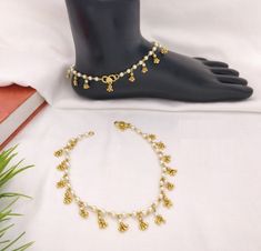 "Kundan Payal/Kundan Anklets/Indian Payal/Indian Anklets/Indian Jewelry/Polki Payal/Sabyasachi Payal/Pajeb/Indian Jewelry/Indian Bridal Payal Features: - Length: 10\"-11\" - Indian Kundan Anklets in Golden finish. - Very Elegant and stylish, this set can be paired with any Attire depending upon the occasion and the theme. - The base is pure brass which makes this very sturdy and of good quality. - 100% guarantee on the polish- it will not lose its finish/color/shine. - Very lightweight and Hand Traditional White Anklets For Festive Occasions, White Anklets With Latkans, White Festive Anklets With Latkans, White Latkans Anklet For Festive Occasions, White Latkans Anklets For Festive Season, Festive White Anklets With Latkans, Festive White Latkans Anklets, Kundan Anklets, Kundan Payal