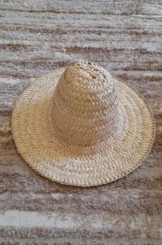 📌 DESCRIPTION: Authentic Berber Hat , Moroccan Berber Hat Chefchawen, Rif Mountain, North Morocco. This Beautiful straw hat is handwoven in Chefchawen from natural palm leaves by Moroccan handicrafts-man. 📌 DETAILS : Full hat diameter :14.56 inch / 37 cm Crown height: 5.11 inch / 13 cm Width of outer edges : 3.93 inch / 10 cm (All the little details are in the pictures) 📌 MATERIAL : Natural palm leaves 📌 COLOR: as shown in the image 🚚📦 SHIPPING & PRODUCTION: Order Production: 1-3 days II n Artisan Natural Panama Hat For Vacation, Artisan Beach Sun Hat In Natural Color, Artisan Style Natural Color Sun Hat For Beach, Artisan Natural Sun Hat For Beach, Natural Artisan Sun Hat For The Beach, Artisan Natural Colored Sun Hat For Vacation, Artisan Natural Sun Hat For Vacation, Artisan Straw Hat For Vacation, Artisan Woven Straw Hat From Palm Leaf