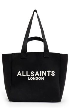 This tote bag is perfect for carrying your essentials and features a convenient pocket along the unlined interior. Open top Top carry handles; shoulder straps Interior wall pocket Unlined Recycled polyester Imported Functional Double Handle Canvas Shopping Bag, Large Black Casual Bag, Large Black Canvas Shoulder Bag, Allsaints Bags With Removable Pouch For Daily Use, Allsaints Shoulder Bag With Removable Pouch For Everyday, Allsaints Bags For Everyday Use, Allsaints Travel Bag With Removable Pouch, Rectangular Allsaints Bag For Daily Use, Allsaints Everyday Bags With Adjustable Strap