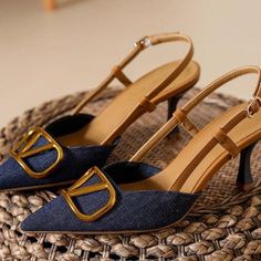 a pair of women's shoes sitting on top of a basket