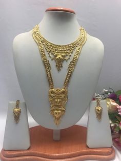 Handmade Indian Jewelry Asian Wedding Bridal Jewellery Party Ethnic Wear 22ct Gold Plated Bridal Necklace Set Rani Haar Bridal Jewellery Set  PLEASE NOTE, This Item Is Not Real Gold .Only Good Quality Gold Plated Jewellery .it is Artificial jewellery. It is a perfect match with formal attire on special occasions or with casual wearing.  Slight Colour variations possible due to difference in screen and photograph Care instructions Keep Jewellery away from direct heat, water, perfumes, deodorants Ceremonial Gold Jewelry With Zari Work, Gold Bridal Sets With Pallu For Traditional Ceremonies, 22k Gold Bollywood Jewelry Sets For Ceremonial Occasions, 22k Gold Bollywood Jewelry Sets For Ceremonial, 22k Gold Bollywood Ceremonial Jewelry Sets, 22k Gold Jewelry With Zari Work, Ceremonial 22k Gold Bollywood Jewelry Sets, Bridal Sets With Intricate Design For Festive Traditional Ceremonies, Gold Plated Bridal Necklace For Puja And Festivals