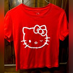 Super Cute Red Crop Top Tee. Hello Kitty Ladies Size L $19 Red Hello Kitty Print Crew Neck Top, Red Cotton Hello Kitty T-shirt, Red Crew Neck Top With Hello Kitty Print, Red Hello Kitty Short Sleeve Tops, Casual Red Hello Kitty Top, Red Hello Kitty Cotton T-shirt, Casual Red T-shirt With Hello Kitty Print, Red Cotton T-shirt With Hello Kitty Print, Cute Red Fitted T-shirt