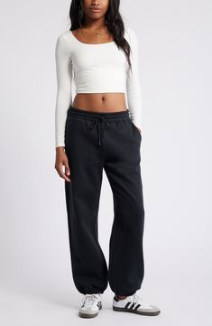 Get into cozy mode with these oversized sweatpants made with soft fleece and the essential elastic waist. Elastic/drawstring waist 68% cotton, 32% polyester Machine wash, tumble dry Imported Not available for sale and shipment to Germany Fall Athleisure Pants With Drawstring, Comfy Black Bottoms With Comfort Waistband, Relaxed Sweatpants With Drawstring For Fall, Relaxed Fit Wide Leg Sweatpants With Ribbed Cuffs, Comfortable Fall Joggers With Drawstring, Sporty Sweatpants With Elastic Cuffs For Leisure, Casual Fall Activewear With Drawstring, Streetwear Fleece Bottoms With Elastic Waistband, Streetwear Fleece Sweatpants With Elastic Waistband