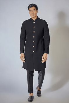 Black full sleeve achkan with textured pattern and mandarin collared neckline. Paired with mexican pant. - Aza Fashions Traditional Stand Collar Kurta For Fall, Festive Kurta With Stand Collar For Fall, Festive Fall Kurta With Stand Collar, Designer Wear Long Sleeve Bandhgala For Fall, Fitted Kurta For Workwear In Fall, Traditional Fall Sherwani For Formal Occasions, Fall Bandhgala With Long Sleeves, Traditional Fall Formal Sherwani, Fitted Fall Wedding Kurta