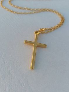 A nice, dainty 14k gold filled necklace with an eye catching plain cross. A dainty Christian necklace that protects the person wearing it. A nice gift for her Length approx. 15 inches / 38 cm - with 1.2 inch extension. ♥ All items will come in a nice gift box ♥ ★ Read our policies before purchase: https://www.etsy.com/shop/Jewellusion/policy/ ★ Convo me for custom orders or any questions you might have ♥ Visit our shop for more fabulous jewels: https://www.etsy.com/shop/Jewellusion/ μ ♥ Follow m 14k Gold Filled Cross Pendant Necklace As Gift, 14k Gold Filled Cross Necklace Gift, Everyday Cross Charm Necklace With Adjustable Chain, Gold Cross Necklace With Delicate Chain For Everyday, Everyday Gold Cross Necklace With Delicate Chain, Everyday Cross Charm Necklace With Clavicle Chain, Everyday Cross Necklace With Clavicle Chain, Gold Cross Necklace For Everyday, Gold Minimalist Personalized Cross Necklace