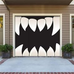 a garage door decorated with an image of a monster's teeth