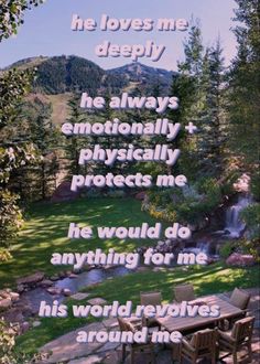 a quote on the back of a wooden table and chairs in front of a mountain