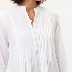 A spin-off from two top-selling blouses combines Pintuck with Eyelet in medium weight cotton. 3/4 sleeves. Mid-thigh. Note that this tunic runs small, we suggest sizing up!