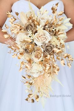 a bride holding a bouquet of flowers in her hands