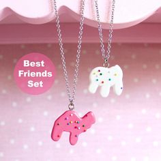 "This cute best friends necklace set is the perfectly pink kawaii handmade gift for your best friend or any woman who loves cute charm jewelry! So nostalgic cute and handmade, these necklaces feature realistic cookie charms on hypoallergenic stainless steel necklaces. Match with your bestie with these cute bff necklaces! Details & Measurements: -Charms are about 1-1.25\" tall (2.5-3.75cm) -Charms are made from resin -Necklace chains are Stainless steel 18\" long (45cm) -Hypoallergenic -Non-tarnish -Set Contains 2 necklaces: 1 Pink Camel Animal Cookie Necklace & 1 White elephant animal cookie nekclace -Handmade Gift Options: -Every order comes with free gift packaging -Shipping directly to recipient? Just include their address in the shipping address section at checkout -Free personalized g Cute Nickel-free Charm Necklace For Friendship, Fun Charm Necklaces For Gifts, Playful Pink Charm Necklace For Friendship, Playful Pink Charm Necklaces For Friendship, Cute Charm Necklaces For Birthday, Fun Nickel-free Jewelry For Friendship, Fun Pink Personalized Charm Necklaces, Personalized Kawaii Jewelry For Birthday, Fun Pink Charm Necklaces