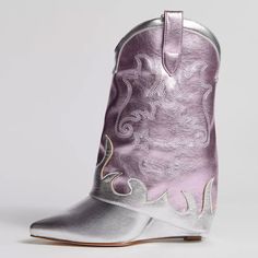 Introducing our Silver and Pink Metallic Fold Over Cowgirl Boots! These eye-catching mid-calf boots feature a stylish wedge heel and a unique fold-over design, perfect for adding a touch of modern Western flair to your outfit. Color: Silver and pink Material: Metallic finish Heel Type: Wedge heel Heel height: 3.15" / 80 mm approx Product measurements were taken using size 8. Please note that measurements may vary by size. Toe: Pointed toe The fold-over boot features a slip-on Western silhouette with a shiny silver and pink color scheme. Embroidery embellishment Handcrafted US sizing. Fits true to size. Western Silhouette, Carnival Christmas, Fold Over Boots, Pink Color Schemes, Modern Western, Pink Metallic, Girl Day, Calf Boots, Heel Type