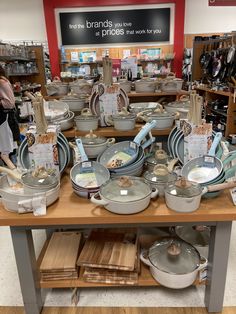 the table is full of pots and pans