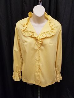 Vintage 1970's Sunshine Yellow Dacron/Cotton Blend Women's Blouse w/ Ruffled Collar.  Top has 4 buttons, darts, and gathered sleeve cuffs.  New Fashion Creation brand.  Top is in excellent condition!  Measurements: shoulder to shoulder 16 in, bust 40 in, waist 36 in, sleeves 23, neck to waist 25 1/2 in. Luxury Yellow Cotton Silk Blouse, Cheap Vintage Yellow Blouse, Affordable Vintage Yellow Shirt, Retro Blouse With Peter Pan Collar And Buttons, Vintage Yellow Top With Ruffles, Vintage Yellow Ruffled Top, Yellow Ruffled Blouse For Workwear, Yellow Ruffled Blouse For Work, Vintage Fashion Collared Blouse With Buttons