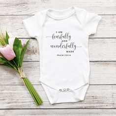 I am fearfully and wonderfully made. Psalm 139:14 This super soft onesie is a perfect gift for a baby shower, baptism and newborn. What a way to welcome one of God's most precious gifts! Baby clothing needs to be both durable and soft. With the infant fine jersey bodysuit, youths get just that. There are seams along the sides of this product. All bindings are made with ribbed knitting for improved durability. There are plastic snaps at the cross closure for easy changing access. Free Shipping on Bible Verse Onesie, Blessing Shower Ideas, Christian Baby Shower Gifts, Christian Baby Onesies, Christian Onesies, Cricut Clothing, Newborn Onsies, Nerd Baby