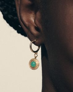 The Cora Earrings, in 18k gold vermeil, are a small hoop earring featuring verdant orbs of Australian chrysoprase set into golden medallions with a radiant star design, inspired by ancient Turkish, Bedouin and Berber jewellery.   
  Emanate the vibrant beauty of a full heart, with the Cora Earrings. Round Chrysoprase Earrings Gift, Gold Chrysoprase Earrings As A Gift, Gold Chrysoprase Earrings For Gift, Gold Chrysoprase Gemstone Earrings, Yellow Gold Chrysoprase Jewelry, Small Hoop Green Earrings Tarnish Resistant, Green Small Hoop Earrings Tarnish Resistant, Small Hoop Green Tarnish-resistant Earrings, Green Tarnish Resistant Small Hoop Earrings