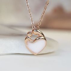 Beautiful handmade item! Here, on Etsy made as simulation only-just resin and white color.  Breastmilk Jewelry two hearts necklace rose gold plated sterling silver chain from KeepsakeMom. Adjustable length BREASTMILK JEWELRY NOTICE: For jewelry made with your own breast milk, please visit www.KeepsakeMom.com ETSY PROHIBITS THE SALE OF JEWELRY MADE WITH BREAST MILK; We sell only breastmilk simulation here, on Etsy( white color, no milk). "KeepsakeMom" AS FEATURED IN : People magazine, Parents, Ca Pink Gold Jewelry With Adjustable Chain For Gift, Pink Gold Jewelry With Clavicle Chain For Gift, Delicate White Heart Pendant Jewelry, Rose Gold Heart Charm Necklace For Keepsake, Rose Gold Heart Charm Necklace As Keepsake, Rose Gold Pendant Jewelry Gift For Mom, Dainty White Heart Necklace For Her, White Delicate Heart Necklace For Mother's Day, Delicate White Heart Necklace For Mother's Day