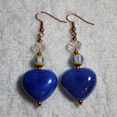 These Are Made With Clay Heart Beads Glass And Crystal Beads On Copper Wire And Earhooks 2 1/2 Inches Long Handmade Blue Handmade Heart Drop Earrings, Blue Handmade Heart Dangle Earrings, Handmade Blue Heart Drop Earrings, Handmade Blue Heart-shaped Beaded Earrings, Handmade Blue Heart Dangle Earrings, Adjustable Heart Beads Dangle Earrings, Blue Dangle Heart Earrings With Heart Beads, Blue Heart-shaped Earrings With Ear Wire, Blue Heart-shaped Jewelry With Colorful Beads