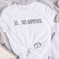 New baby on the way? What a fun way to announce your pregnancy with this pregnancy announcement shirt❤️ 🧵- This is a classic unisex jersey short sleeve tee, It's made from 45% recycled polyester and 55% organic cotton made to order specially for you! Athletic Heather has a different composition of 90% organic cotton and 10% recycled polyester. This t-shirt has a modern semi-relaxed fit with a trendy high neckline.   🫧 - Care and wash instructions: Machine wash: cold (max 30C or 90F); Non-chlor Maternity Graphic T-shirt With Crew Neck, Maternity Graphic Tee With Crew Neck, Bump Friendly Family Matching Cotton T-shirt, Maternity Graphic Tee With Short Sleeve, Bump Friendly White Short Sleeve T-shirt, Pre-shrunk T-shirt For Summer Gender Reveal, Summer Graphic Tee For Gender Reveal, Maternity T-shirt With Graphic Print And Relaxed Fit, Casual White Maternity T-shirt