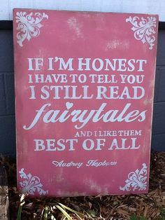 a pink sign that says if i'm honest i have to tell you i still read fairy tales and like them best of all