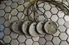 an assortment of electrical wires and plugs on a tiled wall