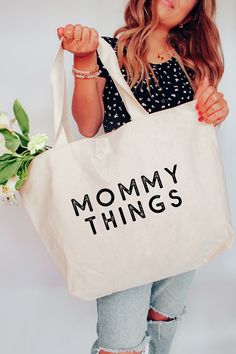 Mommy Things Tote Bag Two Sizes Medium Measurements 16" W x 15" H x 3" D Large Measurements 20" W x 15" H x 5" D   22" Handles 100% Cotton Made in the USA Letter Print Bags For Shopping On Mother's Day, Casual Shoulder Bag For Mother's Day, Casual Everyday Shoulder Bag For Mother's Day, Mother's Day Shopping Tote Canvas Bag, Large Capacity Bags For Shopping On Mother's Day, Large Capacity Everyday Shoulder Bag For Mother's Day, Trendy Shoulder Bag For Mother's Day, Casual Tote Bags For Mother's Day, Cricut Tote Bag Ideas